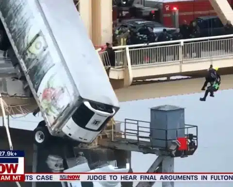 Truck Driver News - Truck Driver Rescued after Big Rig Hangs Off of Bridge
