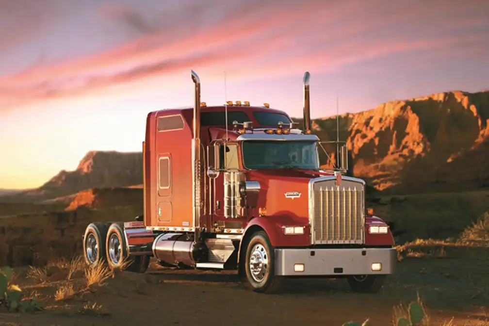 Kenworth is retiring its W900, T800W, and C500 models by 2026 due to emissions regulations and component constraints, ending production of these iconic trucks.