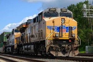 Rail Merger review is paused as federal regulators seek more proof behind claims that millions of truckloads could shift from commercial trucks to railroads.