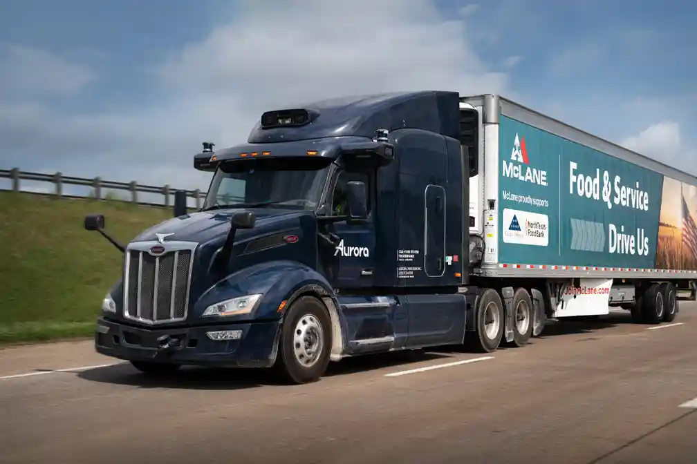 Aurora driverless trucks will haul McLane freight in Texas, while company truck drivers will continue handling local deliveries to customer locations.