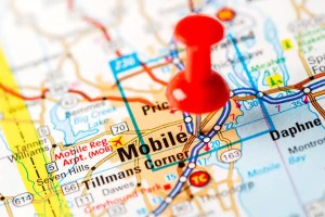Financing for an I-10 bridge project moves forward in Alabama, with plans to ease truck congestion, improve port access, and create a direct hazmat route.