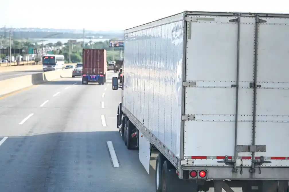 FMCSA reviews a new rear-end collision warning system for commercial trucks as safety officials examine its flashing lights and possible crash risks.